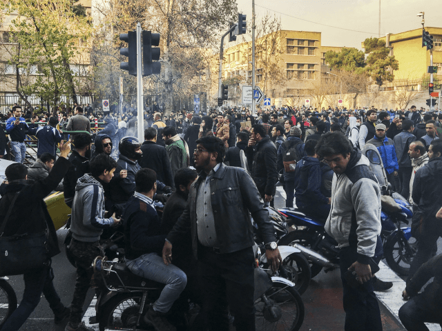 In this photo of Iranian protests taken by an individual not employed by the Associated Press and obtained by the AP outside Iran, demonstrators gather to protest against Iran's weak economy, in Tehran, Iran, Saturday, Dec. 30, 2017. A wave of spontaneous protests over Iran's weak economy swept into Tehran …