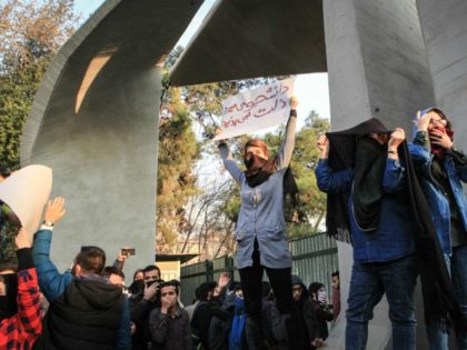 Iranian students protest at the University of Tehran during a demonstration driven by anger over economic problems, in the capital Tehran on December 30, 2017. Students protested in a third day of demonstrations sparked by anger over Iran's economic problems, videos on social media showed, but were outnumbered by counter-demonstrators. …