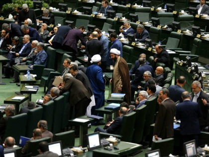 Iranian MPs attend President Rouhani's presentation of the for 2018-2019 budget to the parliament on December 10, 2017, in Tehran. / AFP PHOTO / ATTA KENARE (Photo credit should read ATTA KENARE/AFP/Getty Images)