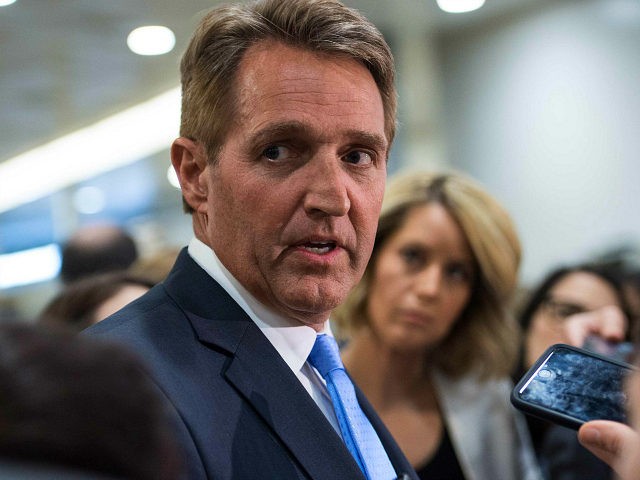 US Republican Senator from Arizona Jeff Flake speaks to reporters after a closed briefing
