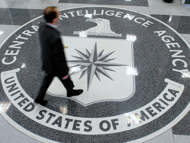 A man crosses the Central Intelligence Agency (CIA) logo in the lobby of CIA Headquarters in Langley, Virginia, on August 14, 2008. AFP PHOTO/SAUL LOEB (Photo credit should read SAUL LOEB/AFP/Getty Images)