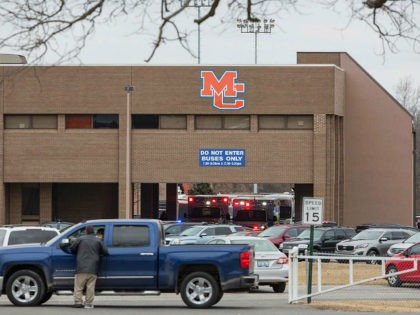 Emergency crews respond to Marshall County High School after a fatal school shooting in Benton, Kentucky (RYAN HERMENS/AP)