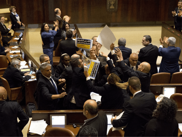 Israeli Arab members hold signs in protest as security pushes them out as U.S. Vice Presid