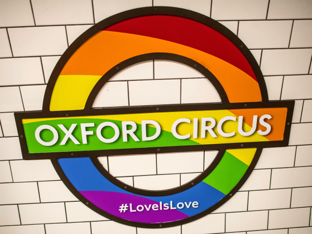 An Underground station sign for Oxford Circus is decorated with …