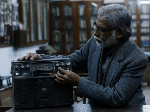 A radio station employee is seen on International Radio Day in Lahore, Punjab, Pakistan, 1