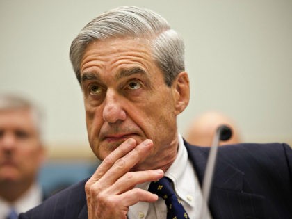 FILE - In this June 13, 2013 file photo, FBI Director Robert Mueller listens as he testifies on Capitol Hill in Washington, as the House Judiciary Committee held an oversight hearing on the FBI. Special Counsel Robert Mueller’s team of lawyers investigating potential coordination between Russia and the Trump campaign …