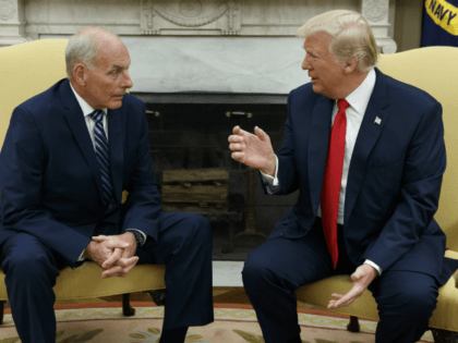 In this July 31, 2017 photo, President Donald Trump talks with new White House Chief of Staff John Kelly after he was privately sworn in during a ceremony in the Oval Office with President Donald Trump in Washington. After a summer of staff shake-ups and self-made crises, President Trump is emerging politically damaged, personally agitated and continuing to buck at the confines of his office, according to some of his close allies. (AP Photo/Evan Vucci)