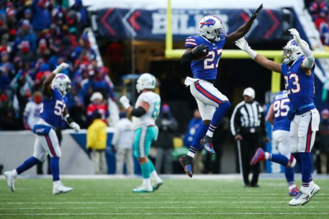 Tre'Davious White of the Buffalo Bills leaps in the air in celebration after intercepting