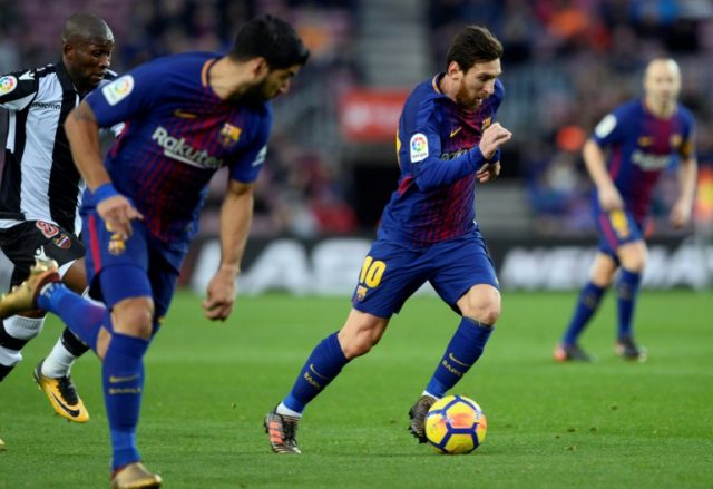 Lionel Messi's 365th La Liga goal came inside 12 minutes, with Luis Suarez adding the seco