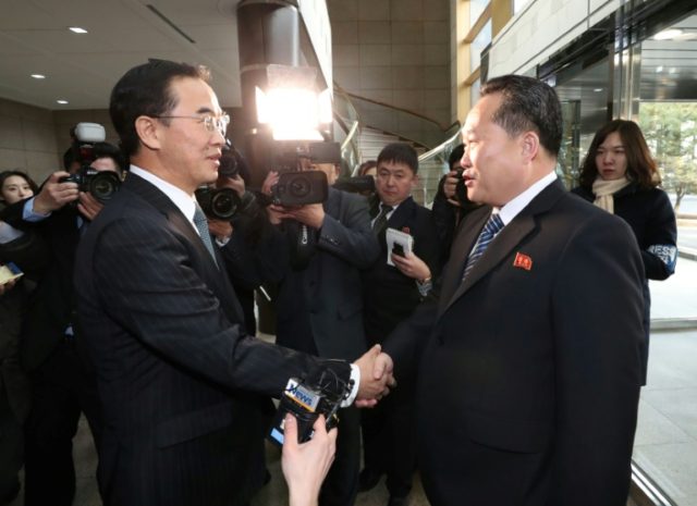 South Korea Unification Minister Cho Myung-Gyun (L) greets North Korean chief delegate Ri