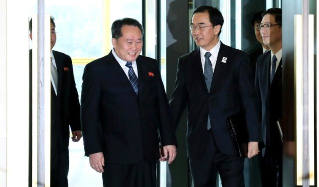 South Korea's Unification Minister Cho Myoung-Gyon (2nd R) greets North Korean chief deleg