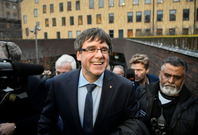 Puigdemont vows to form new Catalan government, escapes EU warrant