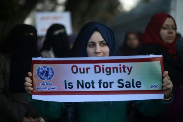 Palestinian women take part in a protest in Gaza City on January 29, 2018 against the US move to freeze funding for the UN agency for Palestinian refugees UN workers in Gaza protest Trump's funding freeze