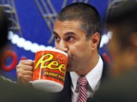 Burger King Net Neutrality Ajit Pai In this Dec. 14, 2017, file photo, Federal Communications Commission (FCC) Chairman Ajit Pai takes a drink from a mug during an FCC meeting where the FCC voted on net neutrality, in Washington. Burger King has a new ad that takes a jab at net neutrality, showing customers being told they will be charged different prices for a Whopper, depending on how fast they want it. (AP Photo/Jacquelyn Martin, File) Ajit Pai