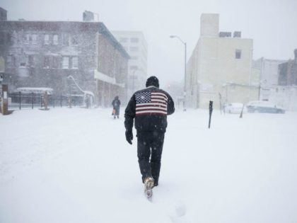 A man pushes his way through a winter snowstorm in Atlantic City, N.J., Thursday, Jan. 4, 2018. A massive winter storm swept from the Carolinas to Maine on Thursday, dumping snow along the coast and bringing strong winds that will usher in possible record-breaking cold. (AP Photo/Matt Rourke)