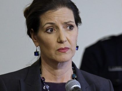 FILE - In this May 13, 2016 file photo, Oakland Mayor Libby Schaaf, left, speaks beside then-Oakland Chief of Police Sean Whent in Oakland, Calif. The teenage daughter of a police dispatcher at the center of a Northern California sexual misconduct scandal involving two dozen officers has filed suit against …