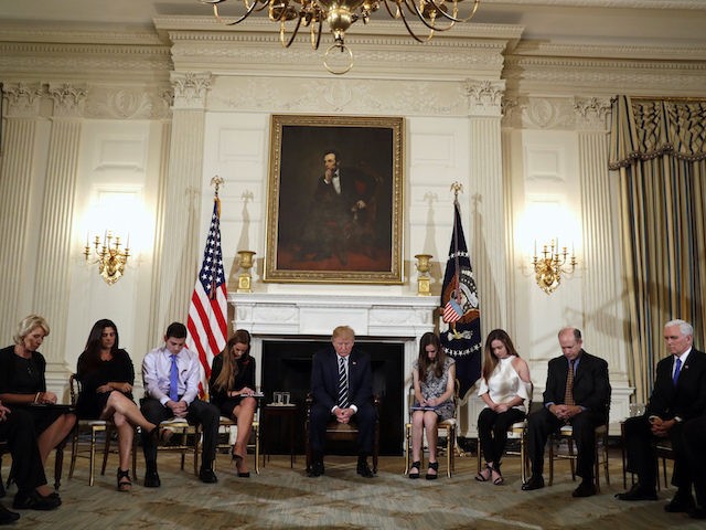 President Donald Trump hosts a listening session with high school students and teachers in the State Dining Room of the White House in Washington, Wednesday, Feb. 21, 2018. (AP Photo/Carolyn Kaster)