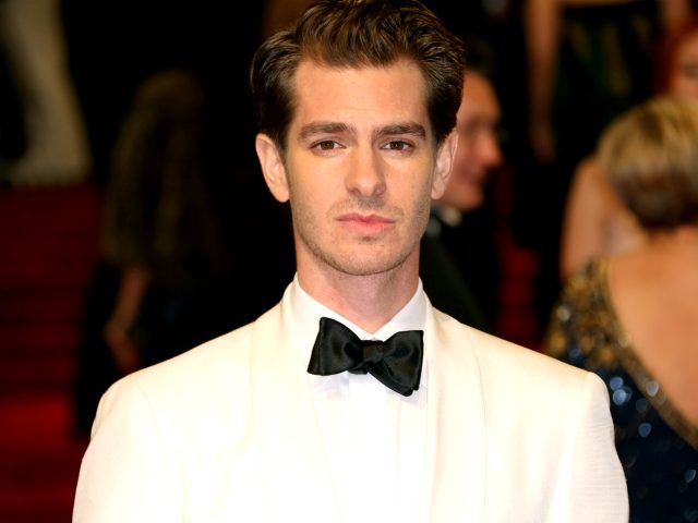 Andrew Garfield poses for photographers upon arrival at the British Academy Film Awards in