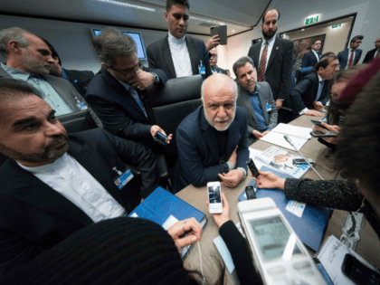 Iran's Oil Minister Bijan Namdar Zanganeh (C) speaks to journalists as he attends the 173rd OPEC Conference of Organization of the Petroleum Exporting Countries (OPEC) in Vienna, on November 30, 2017. ?The OPEC will discuss a possible extension beyond March of its pact with Russia and other major oil producers …