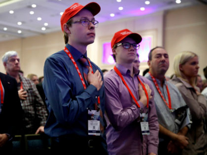 Trevor Tovsen, center, with the University of Maryland College Republicans, says the Pledge of Allegiance, during the Conservative Political Action Conference (CPAC), at National Harbor, Md., Friday, Feb. 23, 2018, where President Donald Trump is expected to speak. (AP Photo/Jacquelyn Martin)