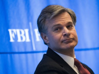 Federal Bureau of Investigation (FBI) Director Christopher Wray looks on during the International Conference on Cyber Security at Fordham University at Lincoln Center, January 9, 2018 in New York City. Wray discussed a variety of topics, including the Bureau's focus on preventing foreign interference in the upcoming 2018 and 2020 …