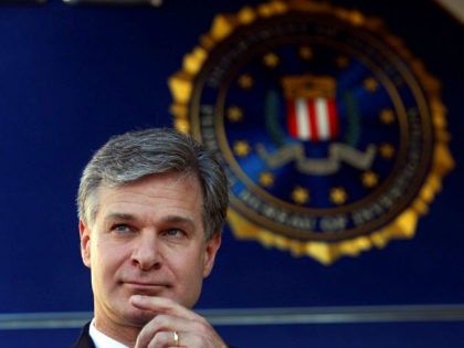 F.B.I director Christopher Wray is shown before speaking to reporters during a dedication ceremony for the new Atlanta Field Office building Thursday, Oct. 12, 2017, in Atlanta, (AP Photo/John Bazemore)