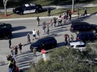Florida School Shooting - Mike Stocker AP Photo Students being led from are brought out of the Marjory Stoneman Douglas High School following shooting that killed 17 students. AP Photo: Mike Stocker