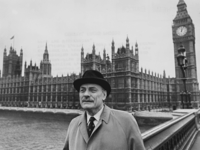 Controversial politician Enoch Powell pictured on Westminster Bridge in view of the Houses of Parliament as he prepares to return to the House of Commons following his resignation from the Conservative Party, London, October 23rd 1975. (Photo by Roger Jackson/Central Press/Getty Images)