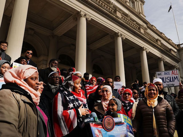 NEW YORK, NY - FEBRUARY 01: Women wear American Flag head scarfs at an event at City Hall