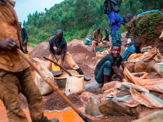 People work at the Kalimbi cassiterite artisanal mining site north of Bukavu, in Democratic Republic of Congo, on March 30, 2017. In the lush hills of eastern DR Congo, where the trade in rare minerals has long fed unrest, miners complain that recent US rules against "conflict minerals" have bitten …