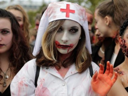 Participants attend the "Zombie Walk" in Paris on October 7, 2017. / AFP PHOTO /