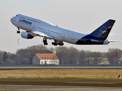 A Boeing 747-8 displaying the new logo of the German airline Lufthansa takes off at the Airport Tegel in Berlin on February 8, 2018. / AFP PHOTO / dpa / Britta Pedersen / Germany OUT (Photo credit should read BRITTA PEDERSEN/AFP/Getty Images)