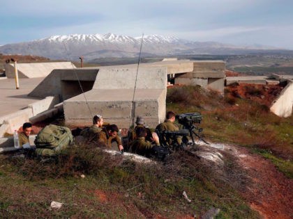 A picture taken on February 10, 2018 show Israeli solders taking positions in the Israeli-occupied Golan Heights near the border with Syria. Syrian air defences repelled an Israeli raid on a military base in the centre of the country, hitting more than one warplane, state media said. The report came …