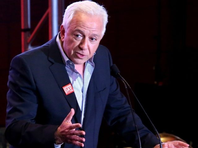 GUESS Foundation president Paul Marciano speaks on stage at the GUESS Foundation and Peace