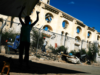 PORT-AU-PRINCE, HAITI - FEBRUARY 10: A child stands in front of a destroyed church in Port au Prince on February 10, 2018 in Port-au-Prince, Haiti. Haiti, the poorest country in the Western Hemisphere, is still reeling from President Donald Trump's comments about the Caribbean nation and his decision to revoke …