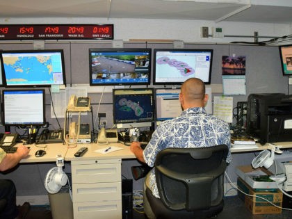 A staffer watches for disaster alerts in the Hawaii Emergency Management Agency command ce