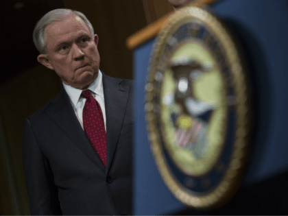 Attorney General Jeff Sessions listens during a press conference at the Department of Justice in Washington, DC on February 27, 2018. Sessions introduced the Prescription Interdiction Litigation task force (PILS), aimed to combat the opiod epidemic. (Photo by Toya Sarno Jordan/Getty Images)