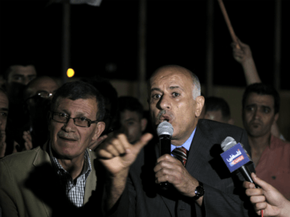 Palestinian football chief Jibril Rajoub (C) speaks to the press upon his arrival in the W