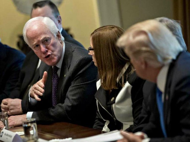 Senate Majority Whip John Cornyn, a Republican from Texas, center left, speaks while U.S. President Donald Trump, right, listens during a meeting with bipartisan members of Congress on immigration in the Cabinet Room of the White House in Washington, D.C., U.S., on Tuesday, Jan. 9, 2018. Trump indicated he's willing to …