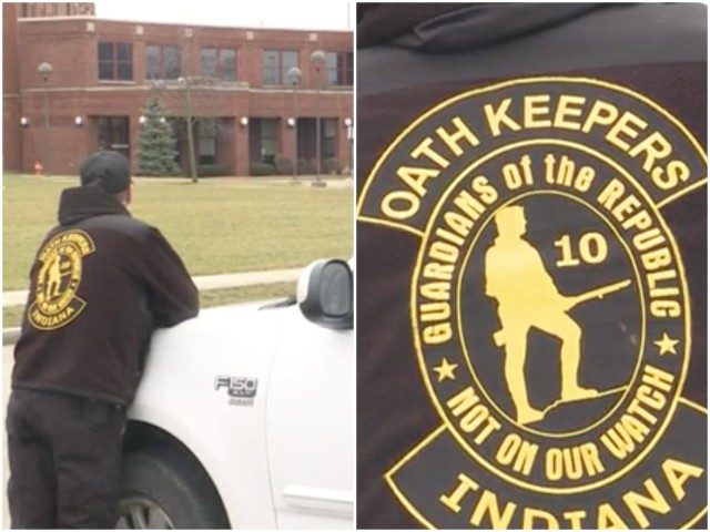 Mark Cowan, an army veteran and Oath Keeper, stands outside an Indiana school and will do