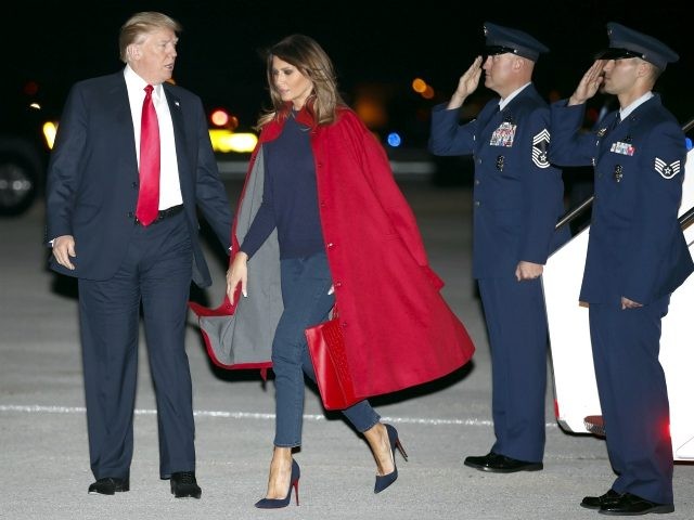 President Donald Trump and first lady Melania Trump arrive on Air Force One at Palm Beach International Airport, in West Palm Beach, Fla., Friday, Feb. 2, 2018. (AP Photo/Carolyn Kaster)