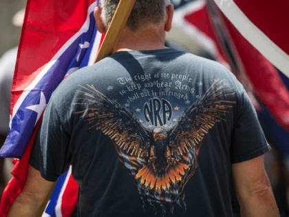 A pro-Confederate flag demonstrator wears a National Rifle Association t-shirt at the South Carolina Statehouse on July 10, 2017 in Columbia, South Carolina. To mark the two year anniversary of the removal of the Confederate battle flag from statehouse grounds, demonstrators erected a pole and flew a replica for several …