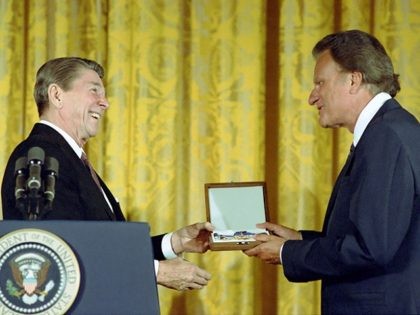 2/23/1983 President Reagan presenting Presidential Medal of Freedom to Bill Graham in the East Room