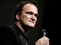 FILE - In this Oct. 18, 2013 file photo, director Quentin Tarantino delivers a speech before receiving the Lumiere Award during the 5th edition of the Lumiere Festival, in Lyon, central France. Tarantino sued Gawker Media LLC on Monday, Jan. 27, 2014, in Los Angeles for copyright infringement over the …
