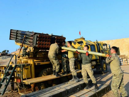 AFRIN, SYRIA - FEBRUARY 23: Turkish soldiers carry rockets, produced with local means, as they make preparations to hit PKK/KCK/PYD-YPG and Deash terror group targets with them via missile batteries, can launch 40 rockets in 80 seconds with 40 kilometers long range even bad weather conditions, on the border line …