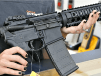 Woman-Holds-AR-15-Rifle-Getty-Images Woman-Holds-AR-15-Rifle-