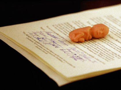 Anti-abortion activist delivered a signed declaration and a plastic fetus to Mick Krieger,