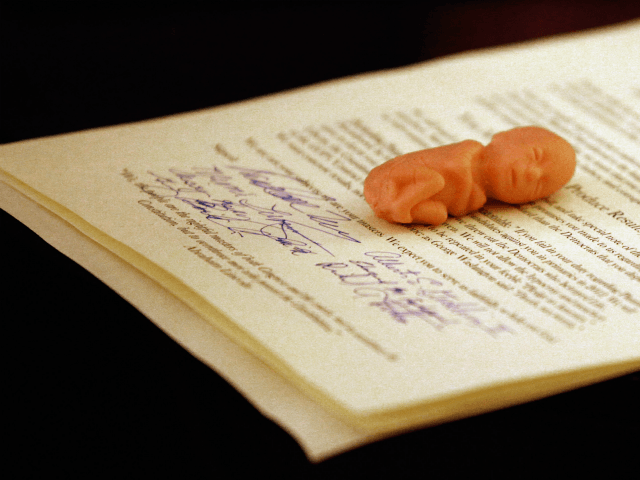 Anti-abortion activist delivered a signed declaration and a plastic fetus to Mick Krieger, chief of staff for House Minority Leader John Boeher (R-OH), during a meeting in the Longworth House Office Building on Capitol Hill November 5, 2010 in Washington, DC. The demonstrators demanded that Boehner, the presumed speaker of …