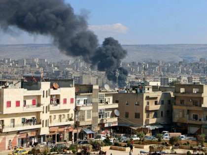 TOPSHOT - Smoke is seen billowing from the northern Syrian Kurdish town of Afrin on January 31, 2018. Turkey and allied Syrian rebel groups launched operation Olive Branch on January 20 against the Kurdish People's Protection Units (YPG), which controls the Afrin region. / AFP PHOTO / Ahmad Shafie BILAL …