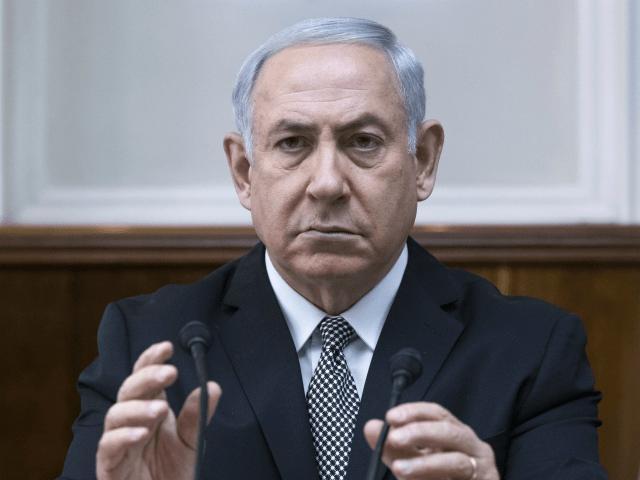 Israeli Prime Minister Benjamin Netanyahu chairs the weekly cabinet meeting in Jerusalem, Sunday, Feb. 4, 2018. (Jim Hollander/Pool via AP)